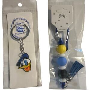 Donald Duck key Chain and Bag Charm set. Brand new with a straw top Not Pictured